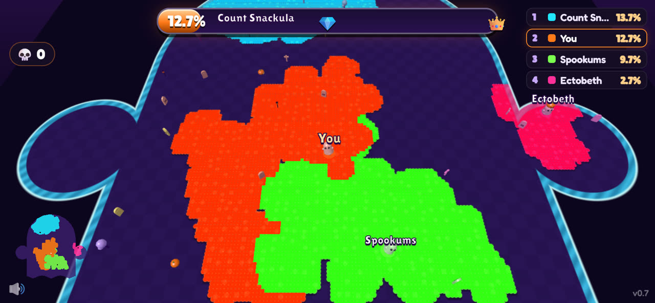 Graveyard.io: orange and green ghosts' land battling for space inside a giant ghost-shaped arena with a glowing cyan edge